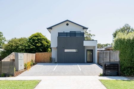 An Australian co-living home with multiple parking bays