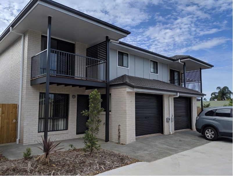 A real Australian two-storey duplex with two garages and two front doors